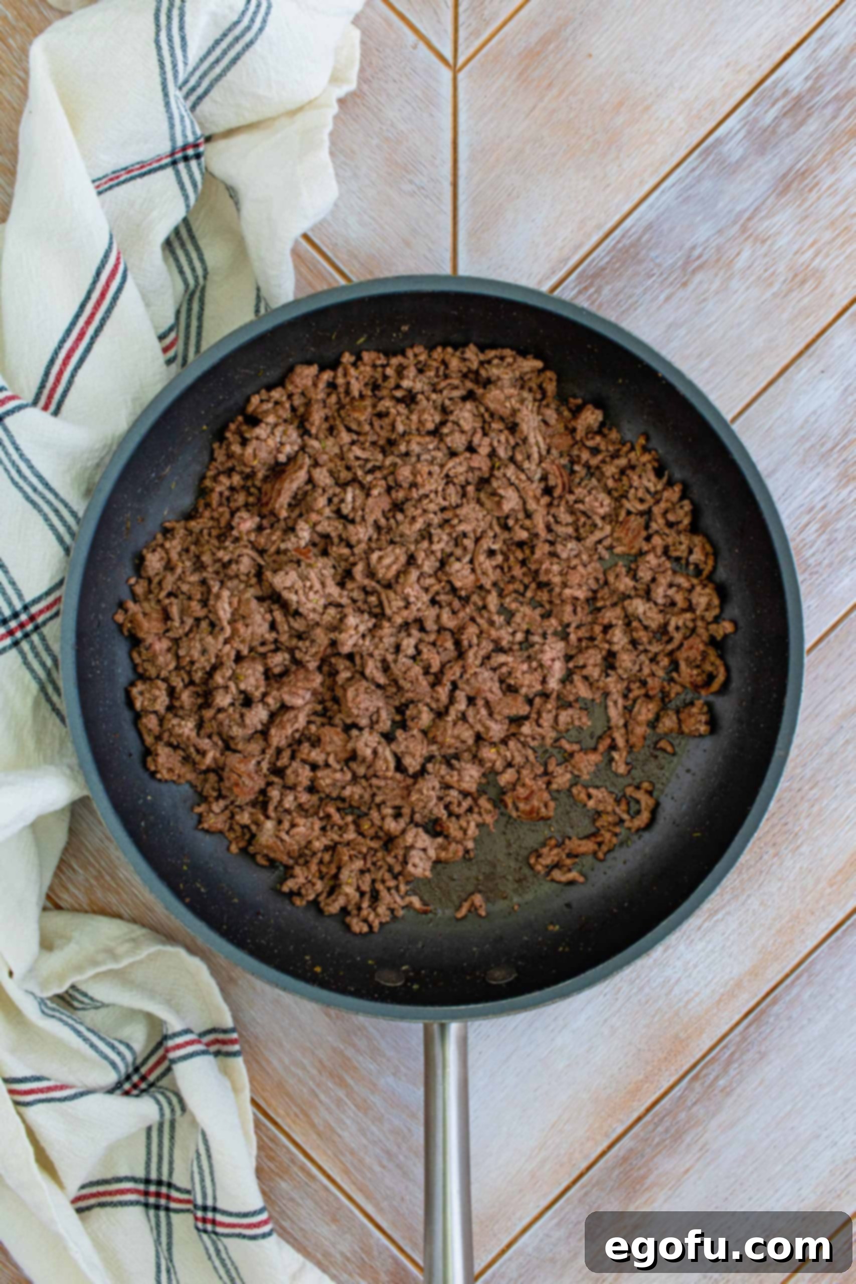 Hearty Homemade Lasagna Bake 5 Ground beef cooked in pan.