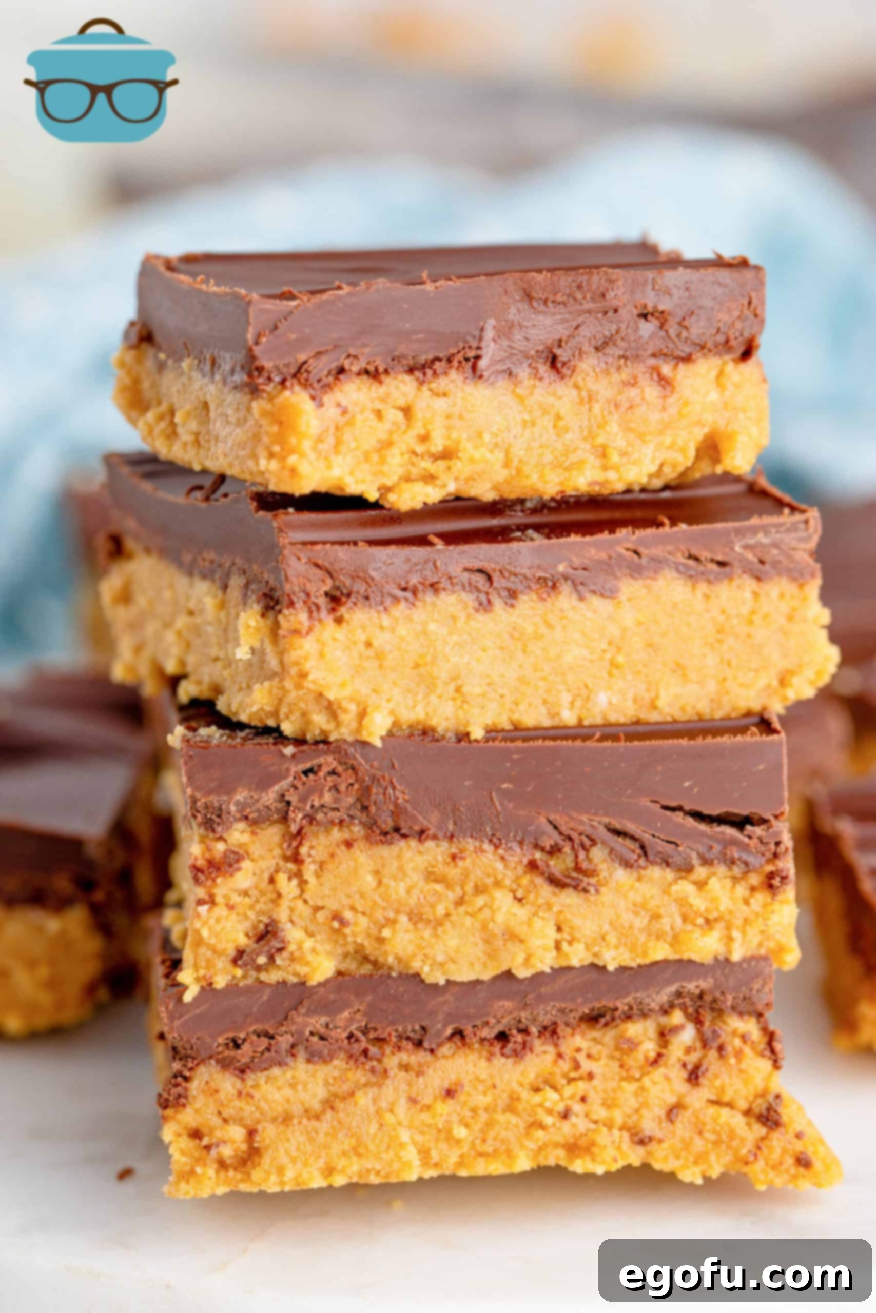 Grandma's No-Bake Peanut Butter Dream Bars 2 Stacked Grandma's Peanut Butter Bars, closeup photo, showcasing layers of peanut butter and chocolate.
