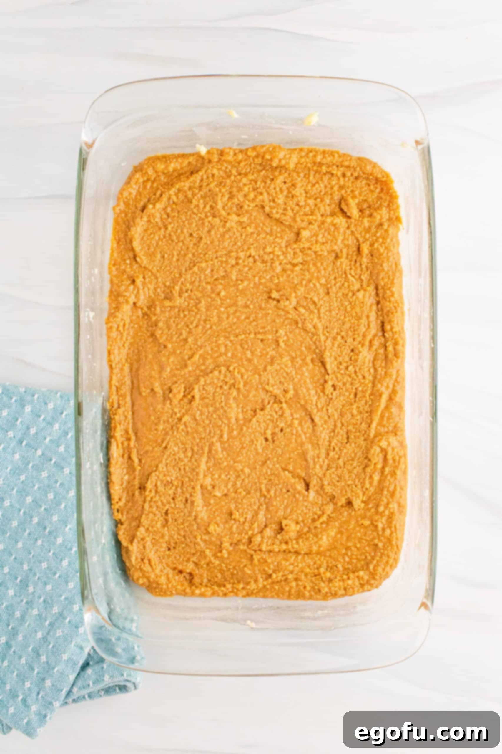 Grandma's No-Bake Peanut Butter Dream Bars 9 The peanut butter mixture evenly spread into the prepared 9x13 inch baking pan, ready for chilling.