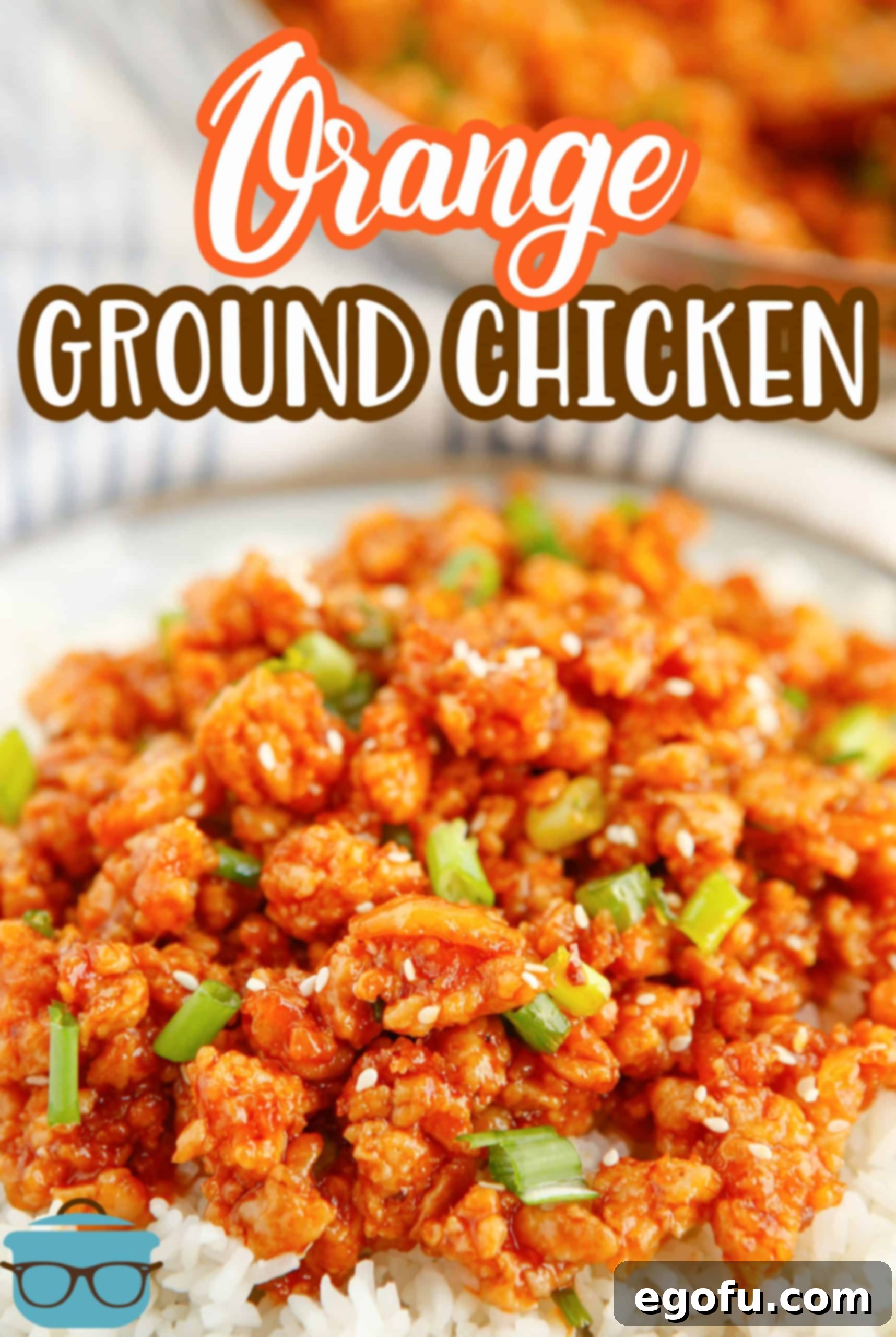 Skillet Orange Chicken Crumble 3 Delicious Ground Orange Chicken served over fluffy white rice, adorned with fresh green onions and sesame seeds, ready to be enjoyed.