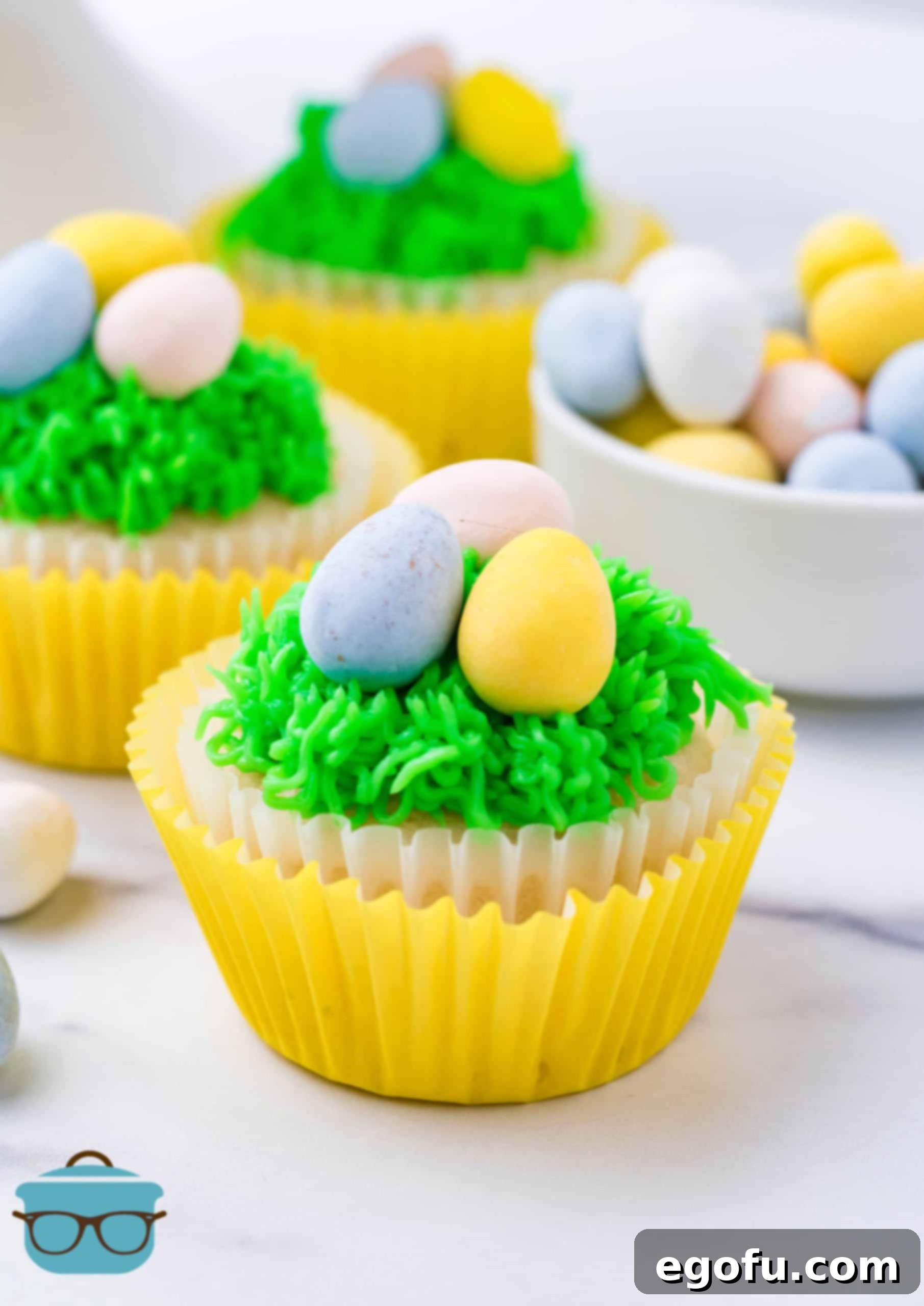 Beautifully decorated Easter Egg Cupcakes nestled in cheerful paper liners, ready for a festive celebration.
