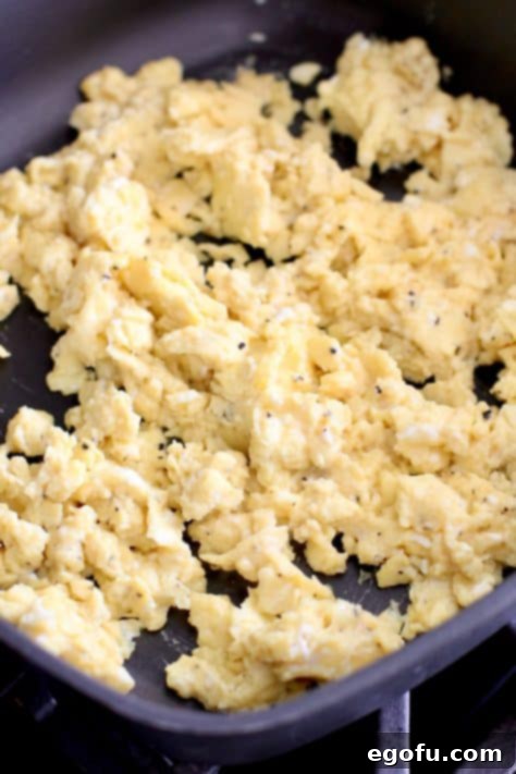 Morning Masterpiece Pizza 15 scrambled eggs shown in a large skillet
