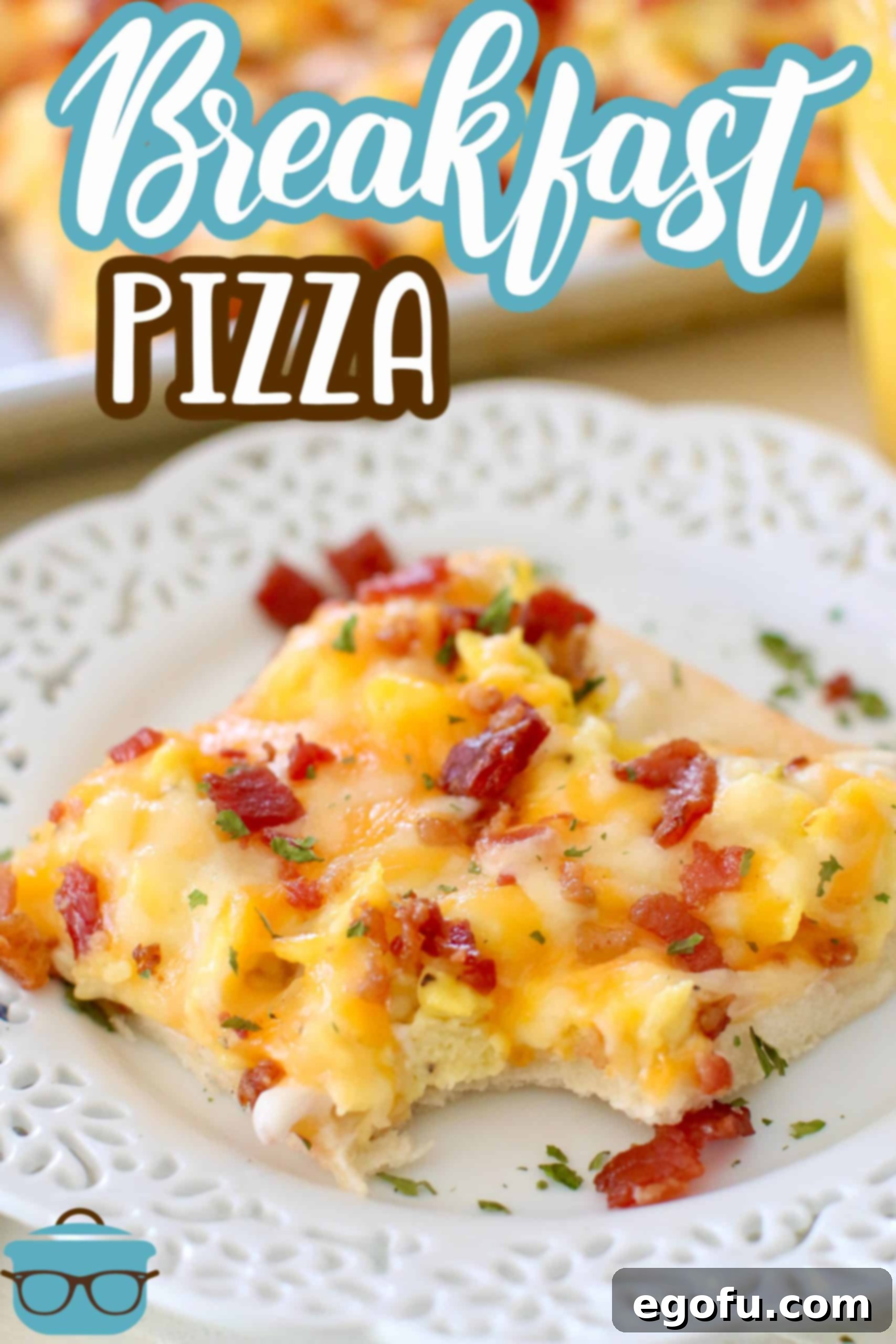 Morning Masterpiece Pizza 4 Easy Breakfast Pizza recipe from The Country Cook, slice shown on a white round plate, one bite removed from the pizza slice.