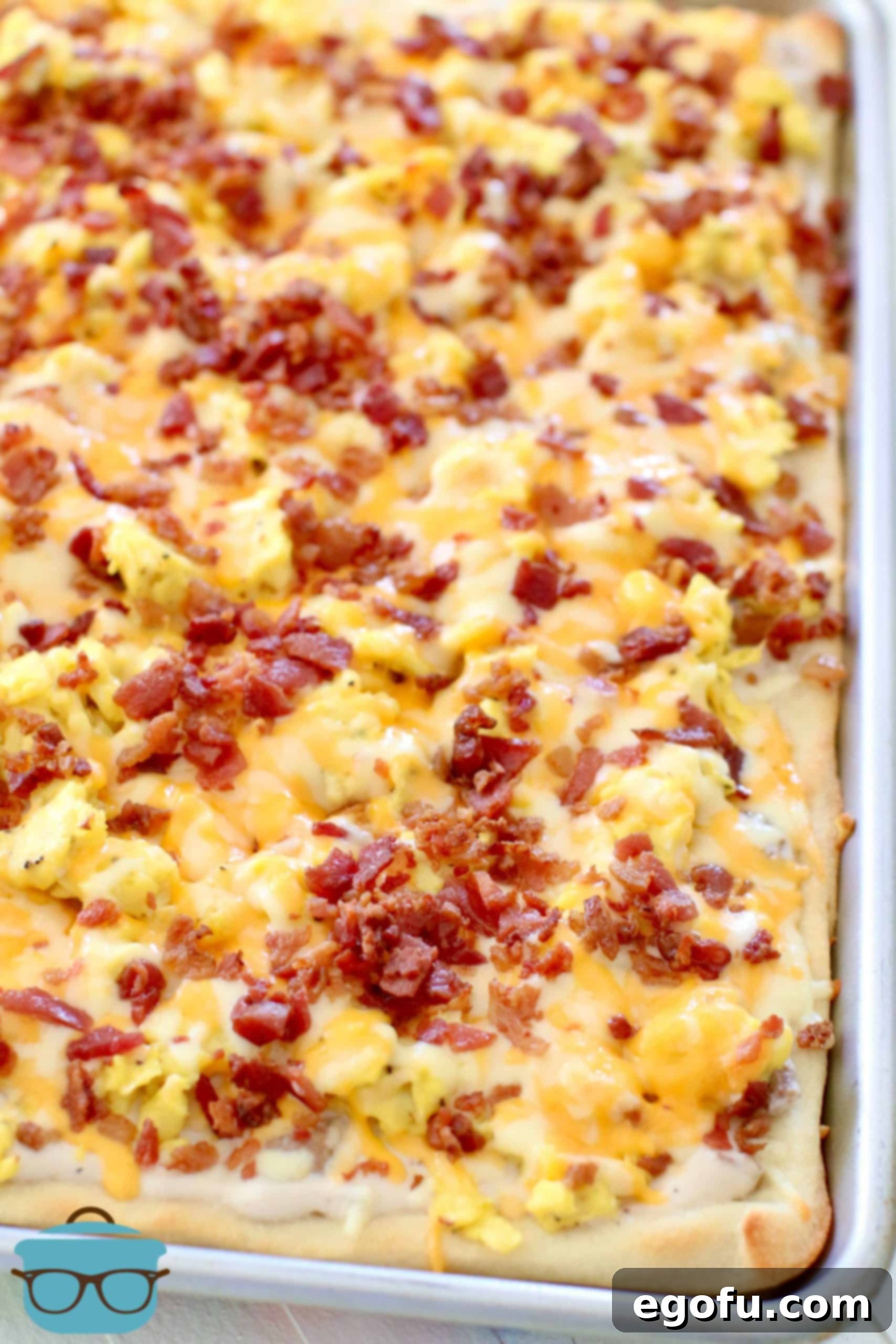 Morning Masterpiece Pizza 9 fully cooked breakfast pizza shown in baking pan.