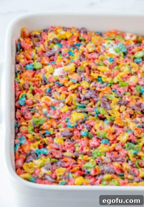 Fruity Pebbles Treats pressed into pan.