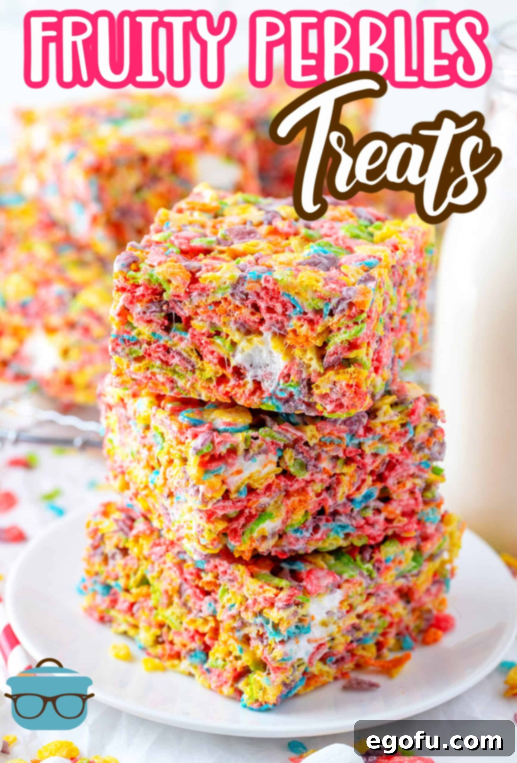 Stacked Fruity Pebbles Treats with more treats in the background, perfect for a Pinterest image.