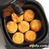 Square image of finished Air Fryer Buttermilk Biscuits in air fryer