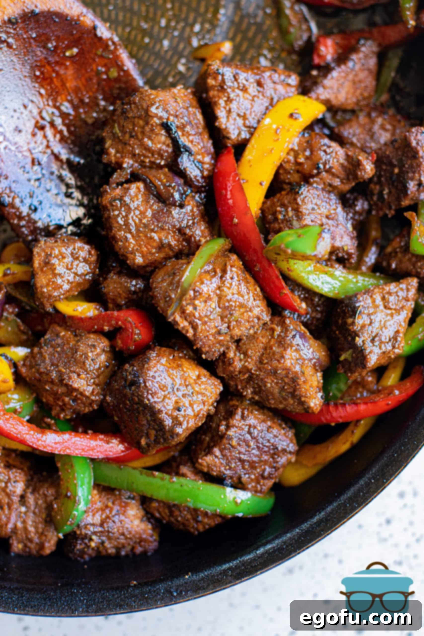 Finished Steak, onions and peppers in pan.