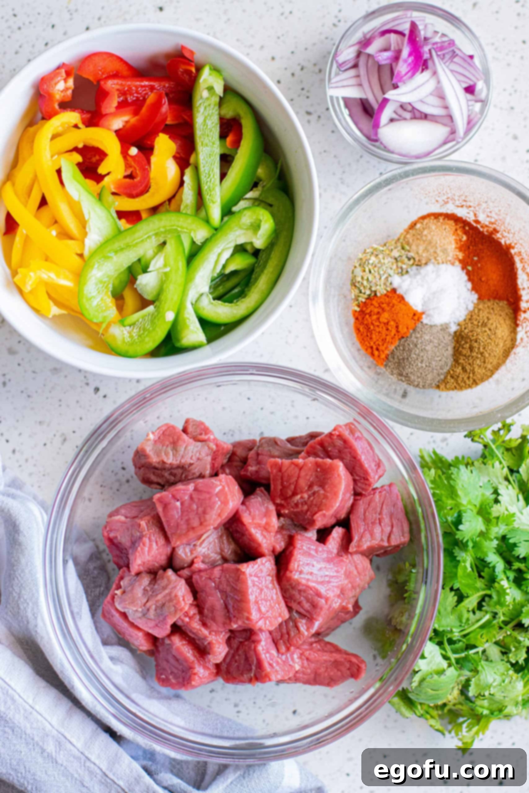 Ingredients needed steak, chili powder, garlic powder, smoked paprika, ground cumin, dried oregano, sea salt, black pepper, olive oil, red onion and bell peppers.