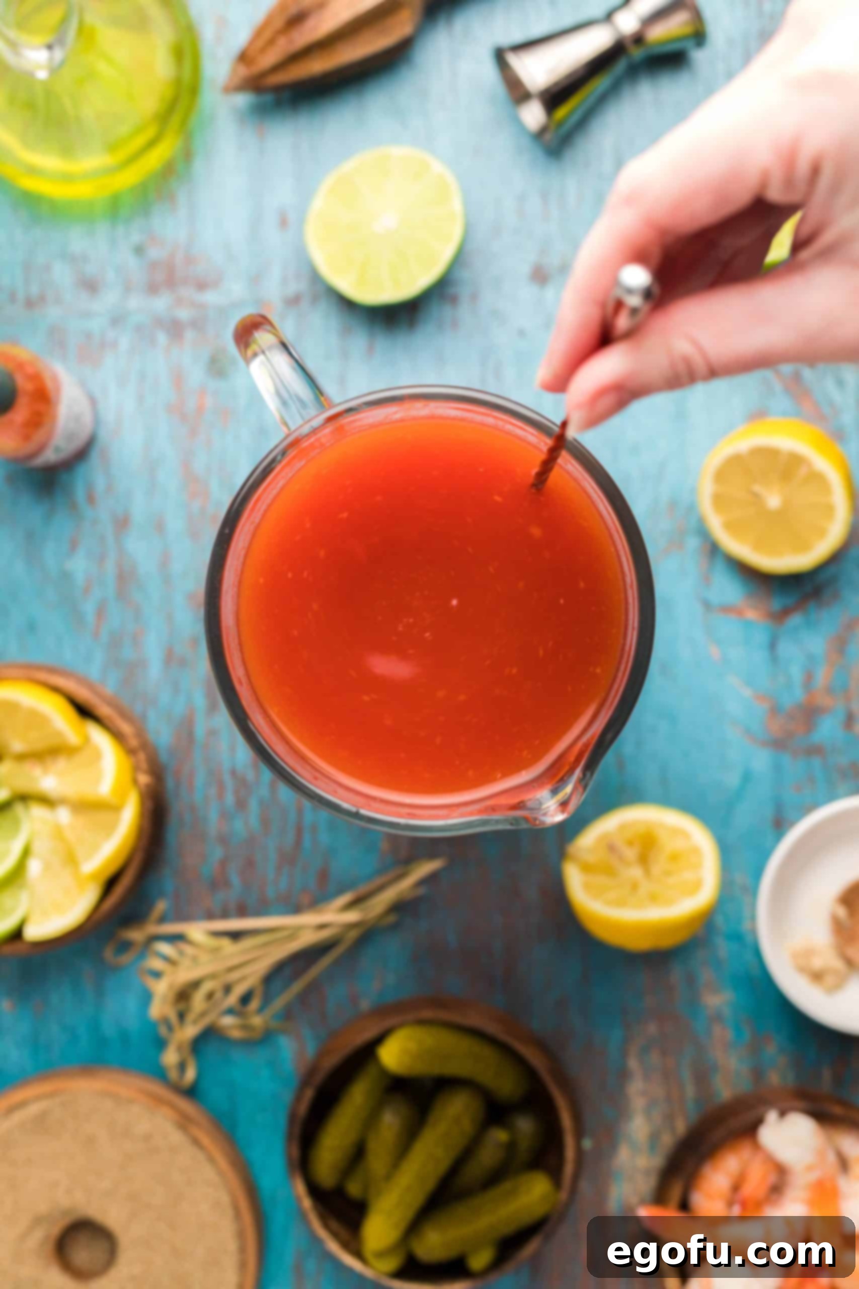 Signature Bloody Mary Blend 11 Bloody Mary Mix being stirred up.