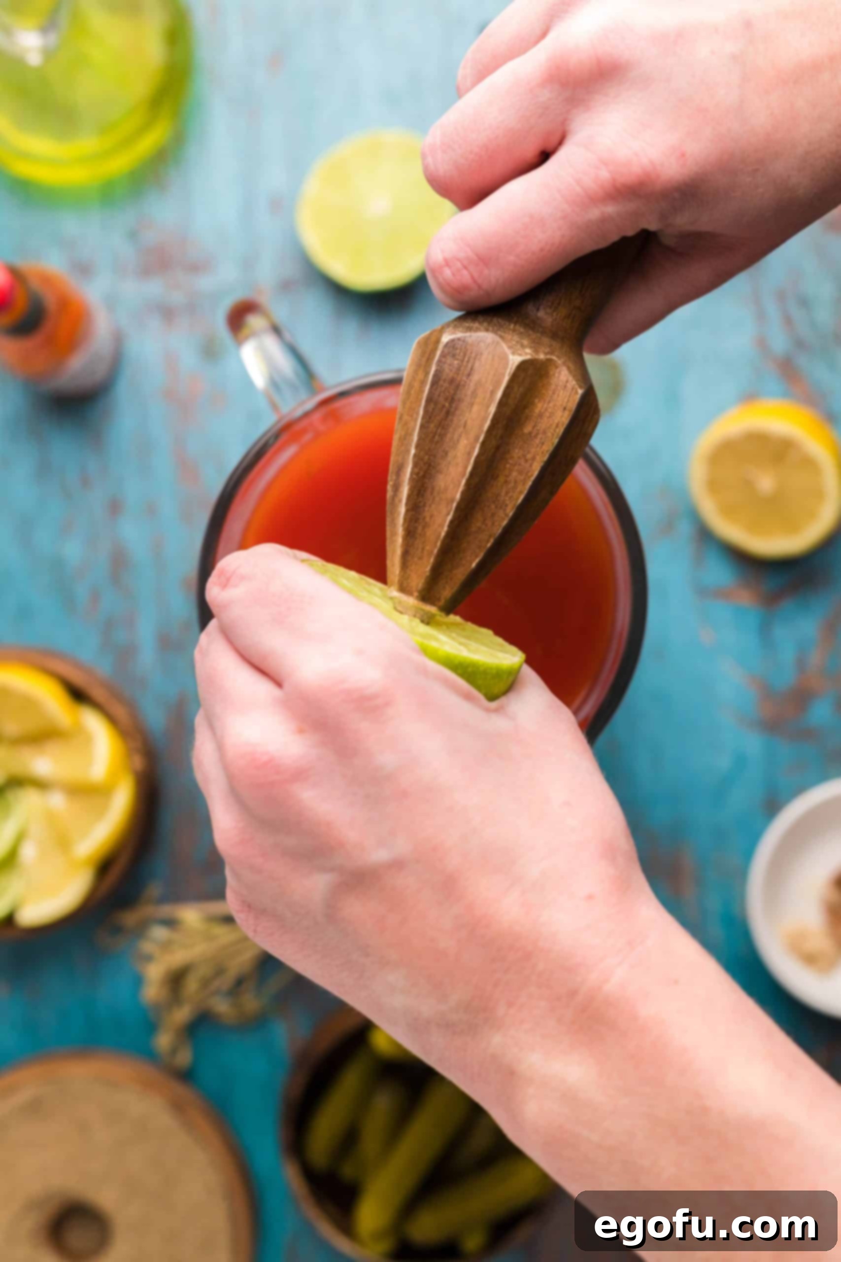 Signature Bloody Mary Blend 8 Lime being juiced.