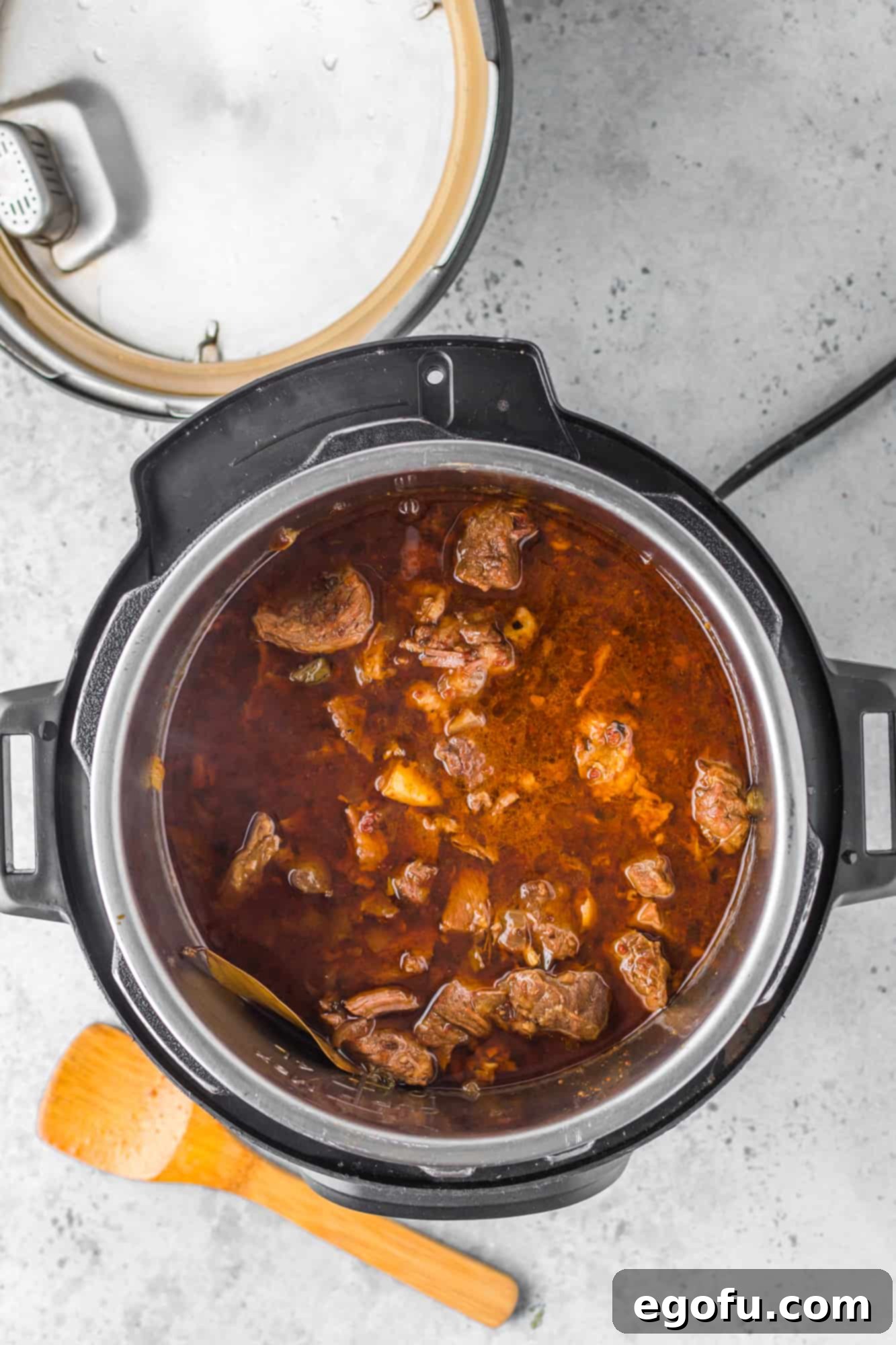 Finished barbacoa in the Instant Pot after cooking and pressure release, ready for shredding.