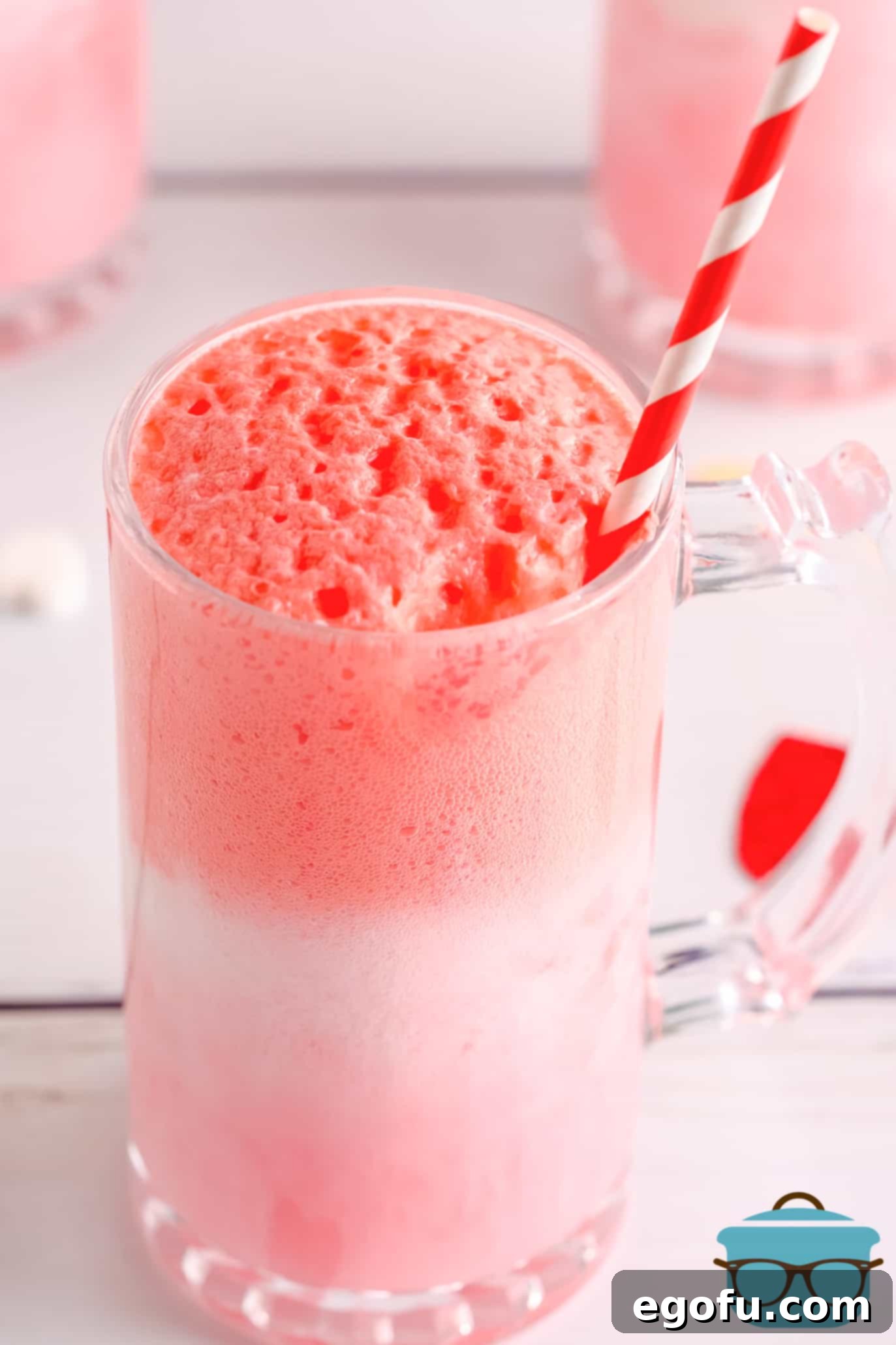 One Strawberry Cream Float Recipe before topping in glass foaming up.