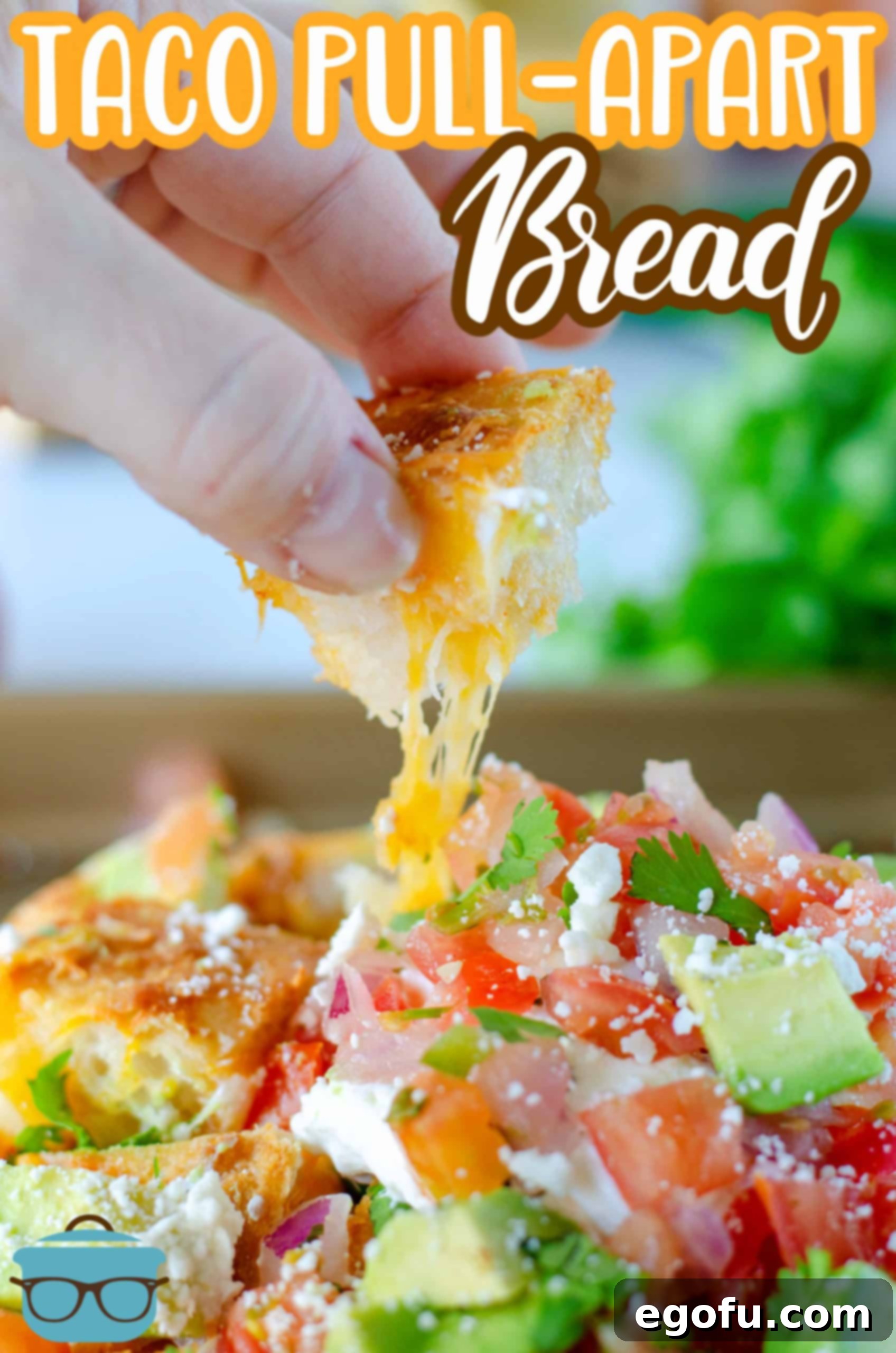 Close-up of a cheese pull from a piece of the bread loaf, demonstrating the gooey, stretchy texture of the melted cheese.