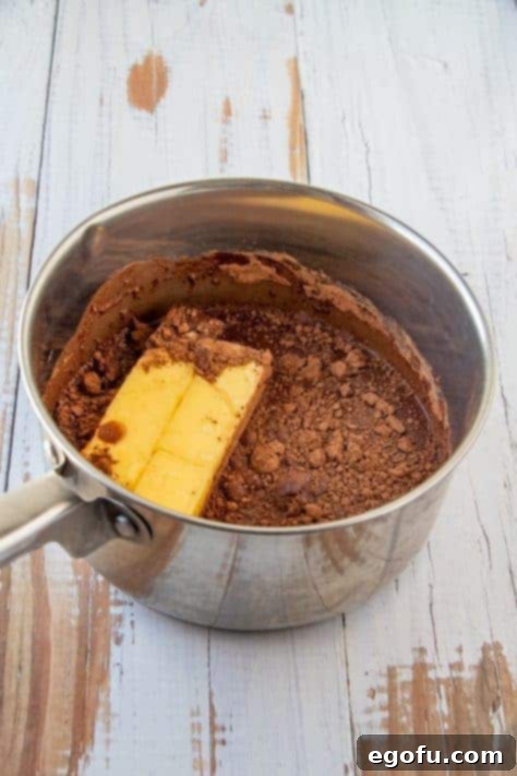 Margarine, water and cocoa powder added to metal sauce pan