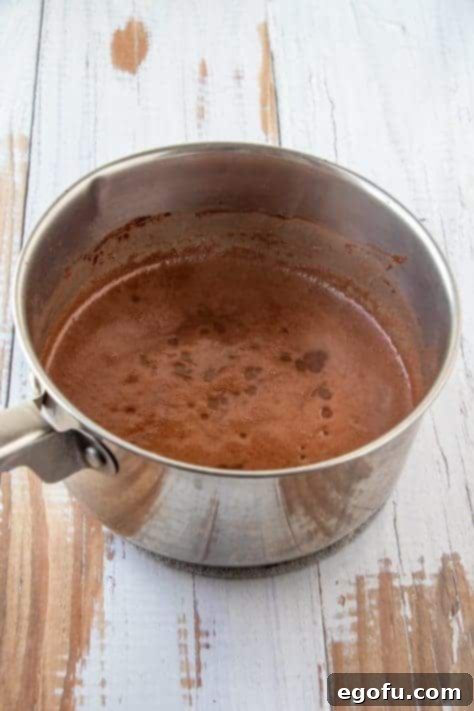 Melted butter, water and cocoa powder mixture in metal pan
