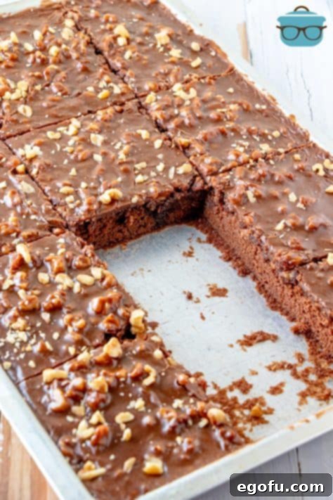 Cake pan of Grandma's Texas Sheet Cake with a few slices missing