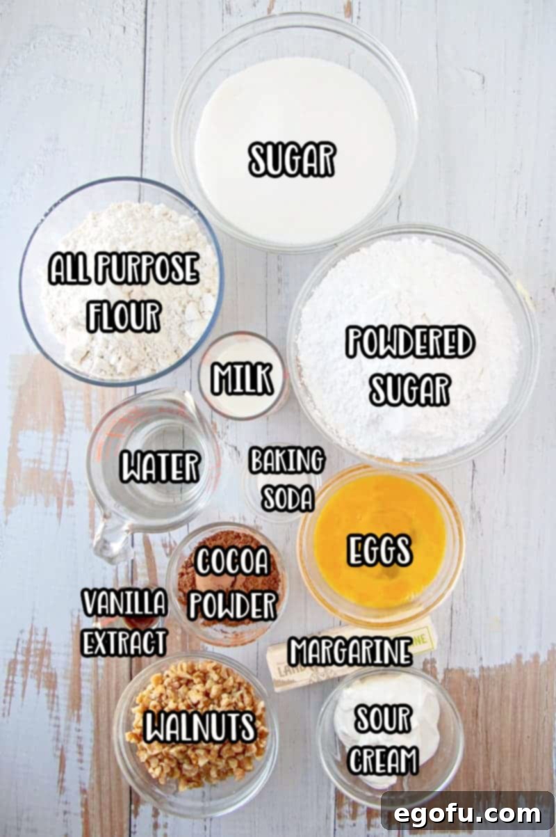 Ingredients needed: margarine, water, cocoa powder, all-purpose flour, eggs, baking soda, granulated sugar, sour cream, milk, walnuts, powdered sugar and vanilla extract. 