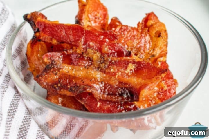 Pig candy in clear bowl with striped linen.