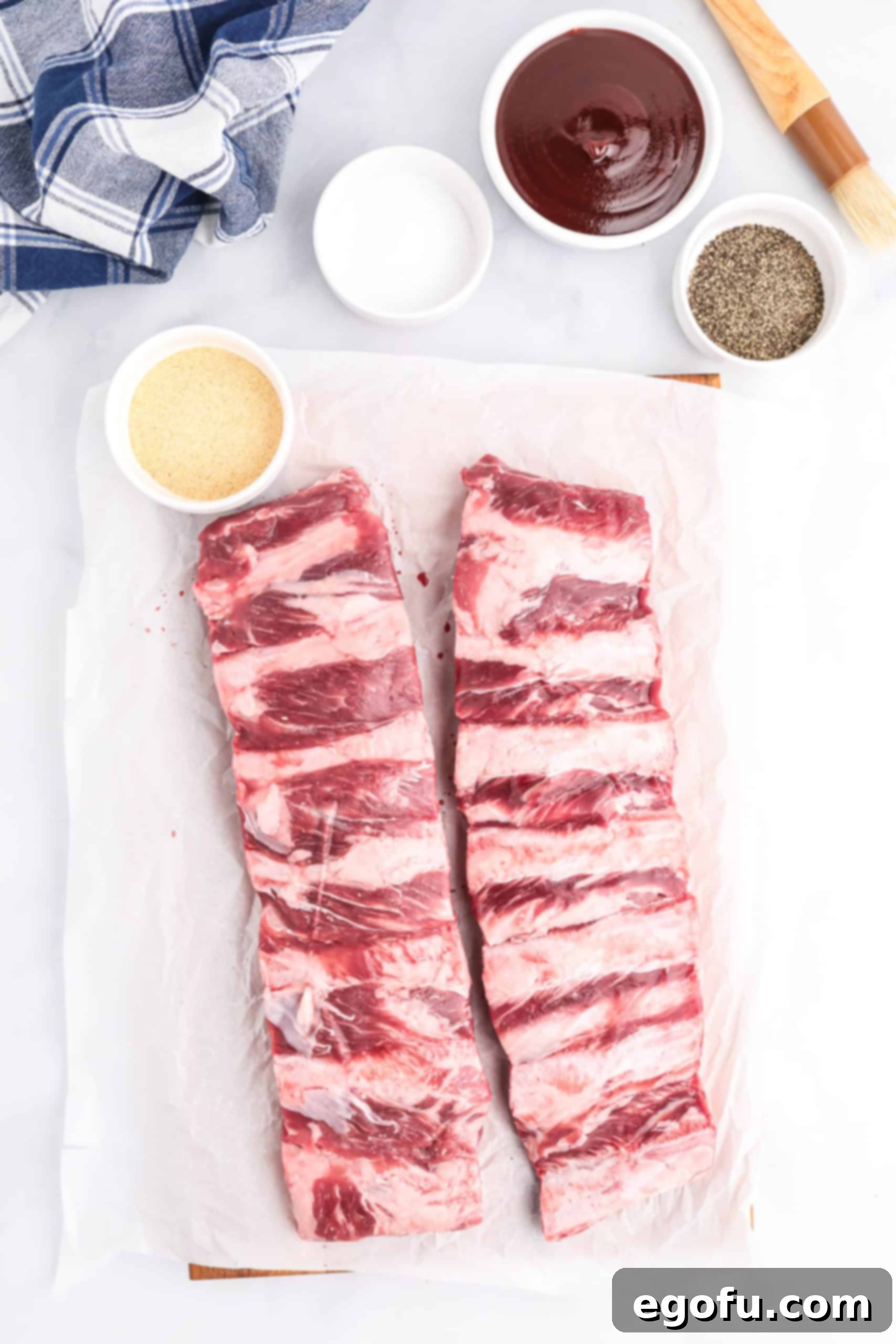 Slow-Smoked Beef Ribs 4 Ingredients needed: Beef ribs, salt, pepper, garlic powder, vinegar and bbq sauce.