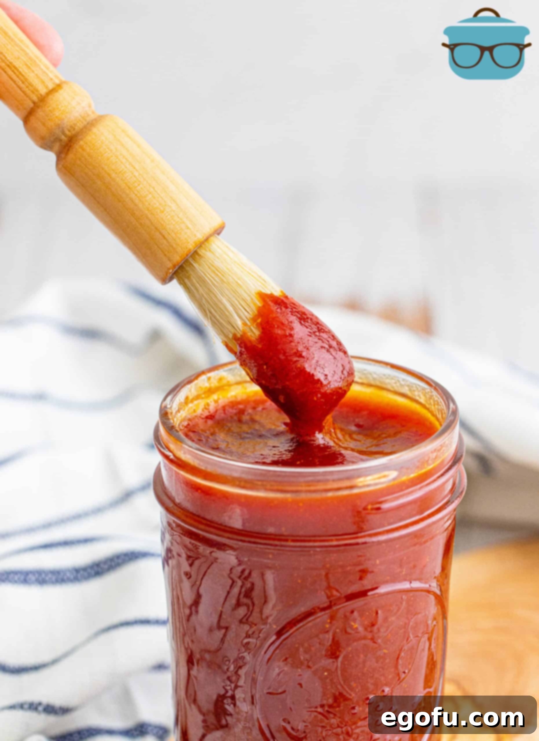 BBQ Dabber grabbing some Homemade BBQ Sauce from jar