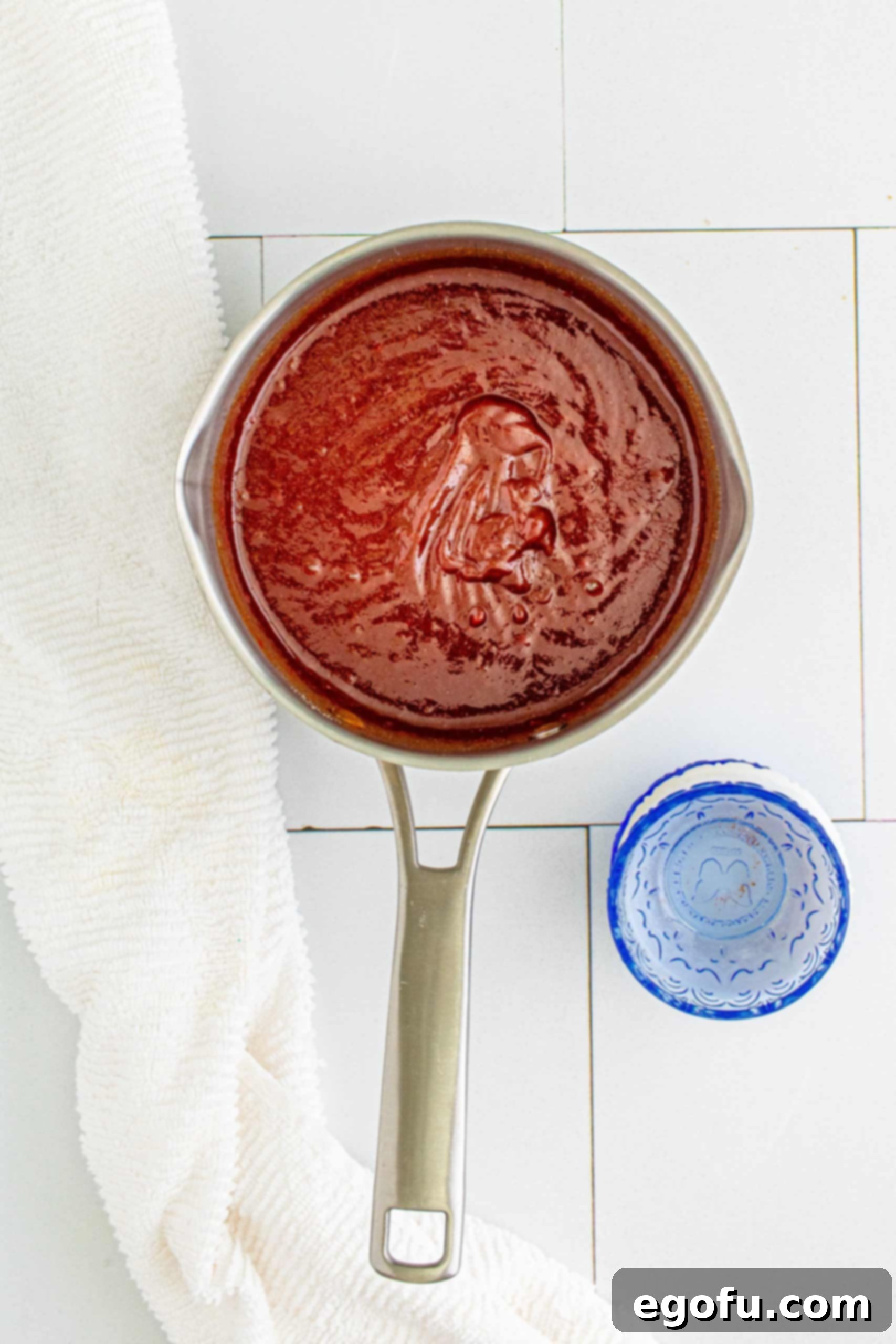 BBQ Sauce simmering in metal saucepan