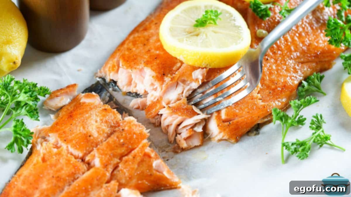 Smoked Salmon finished with fork pulling it apart appearing flaky