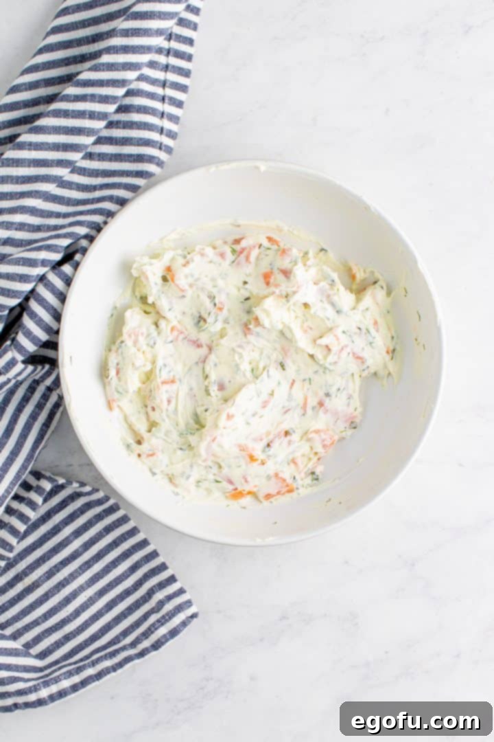 The smoked salmon, dill, and cream cheese filling, perfectly mixed and ready for piping.