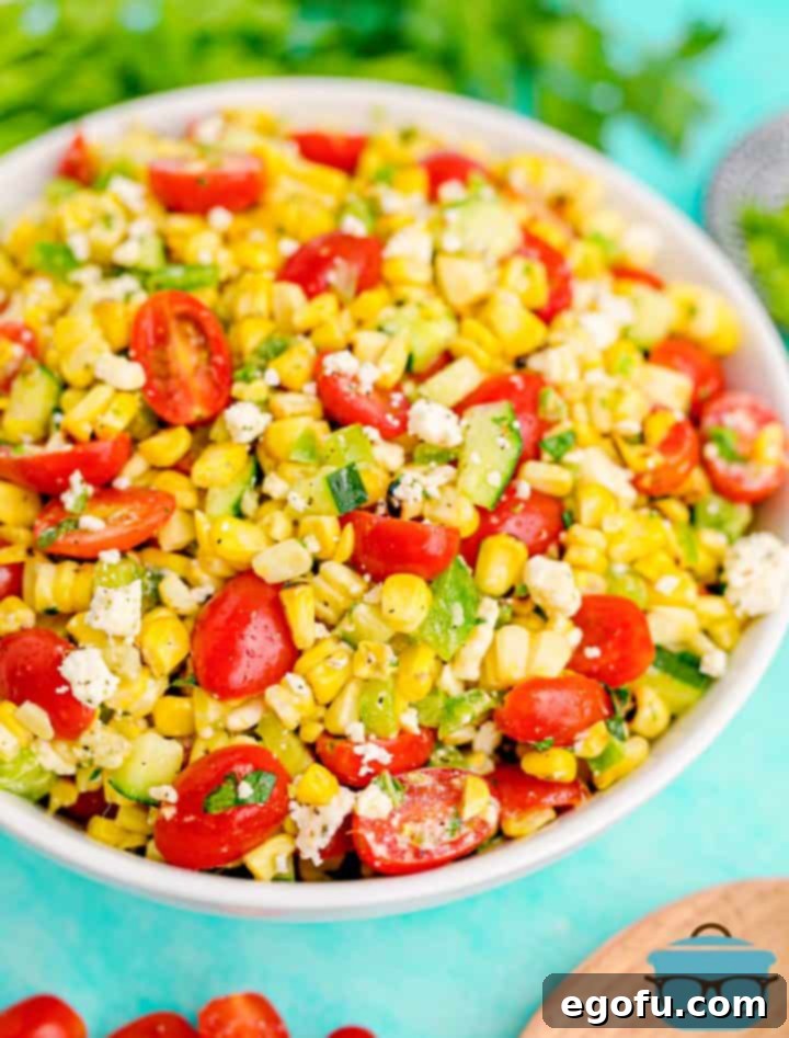 Beautifully plated Summer Corn Salad with a serving spoon