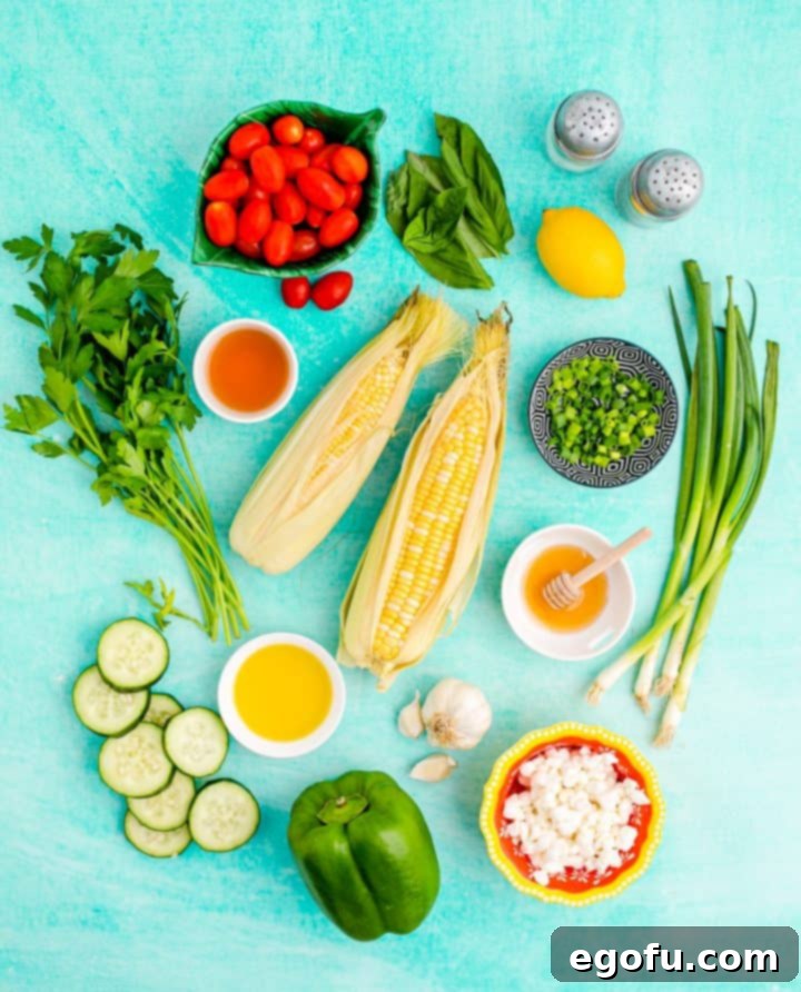 Ingredients needed: corn, olive oil, salt, pepper, grape tomatoes, cucumbers, green onions, bell pepper, goat cheese, apple cider vinegar, lemon juice, garlic, parsley, basil leaves and honey