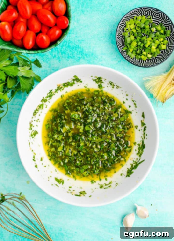 Whisking vinaigrette ingredients until combined
