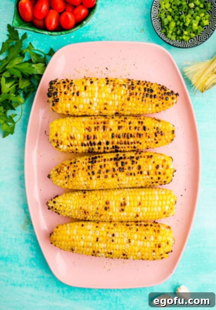 Grilled corn cobs resting after cooking