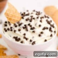 Square image of Cannoli Dip finished and garnished in white bowl