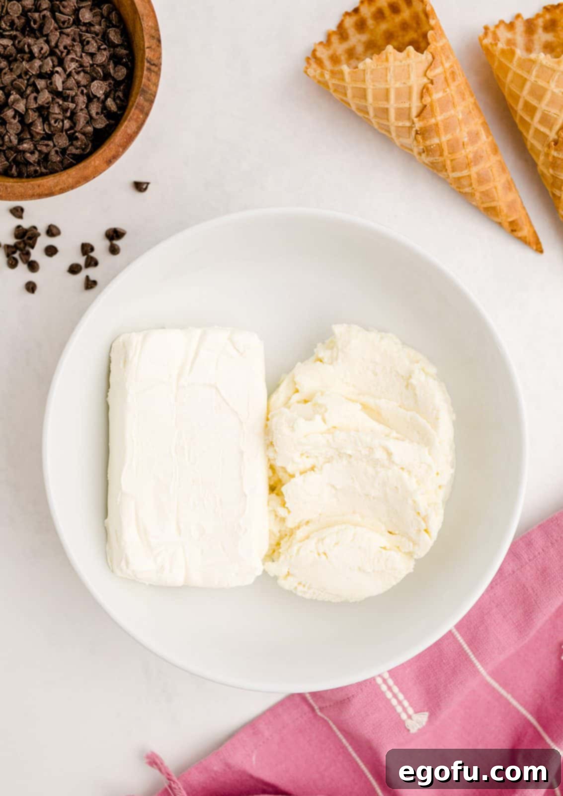 Cream cheese and ricotta cheese combined in a pristine white bowl, ready for mixing to create the perfect base for Cannoli Dip.
