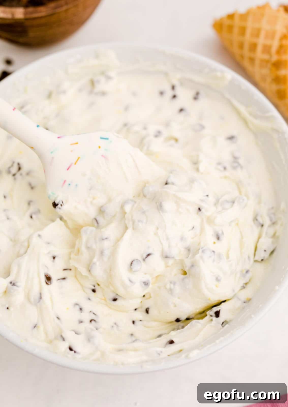 The perfectly mixed Cannoli Dip, smooth and ready to be chilled, resting in a pristine white bowl.