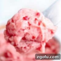 Square image of Raspberry Honey butter on butter knife