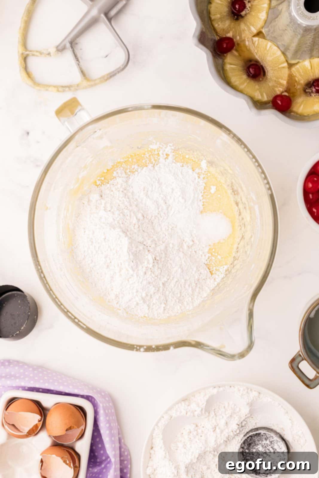Sunshine Pineapple Bundt Cake 11 Half of the dry ingredients (flour, baking powder, salt) mixed into the wet batter in the stand mixer.