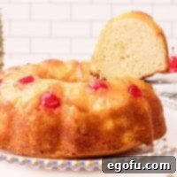 Sunshine Pineapple Bundt Cake 19 Close up of finished Pineapple Upside Down Bundt Cake Recipe with slice being removed