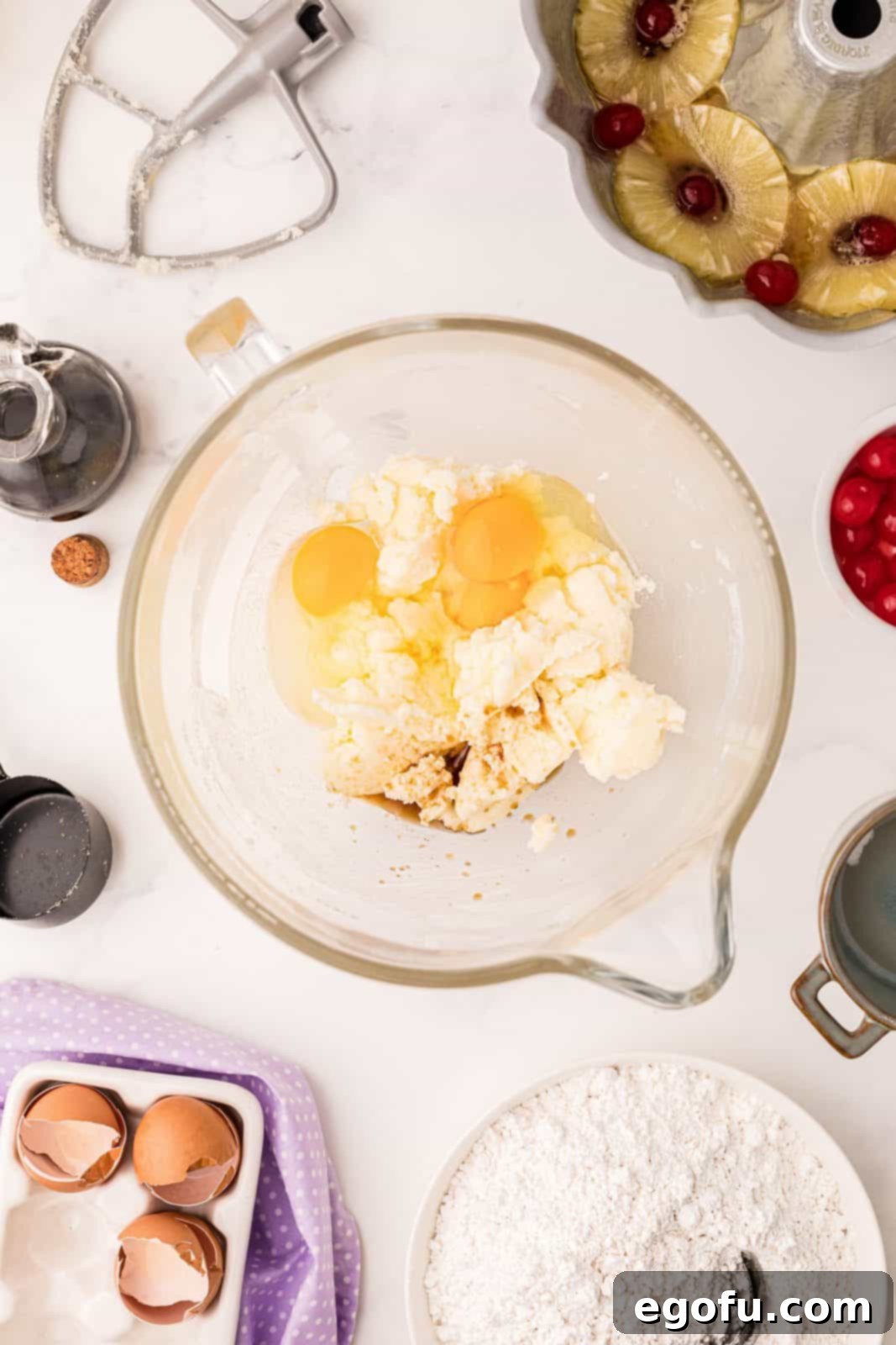 Sunshine Pineapple Bundt Cake 10 Eggs and vanilla extract added to the creamed butter and sugar mixture in the mixer.
