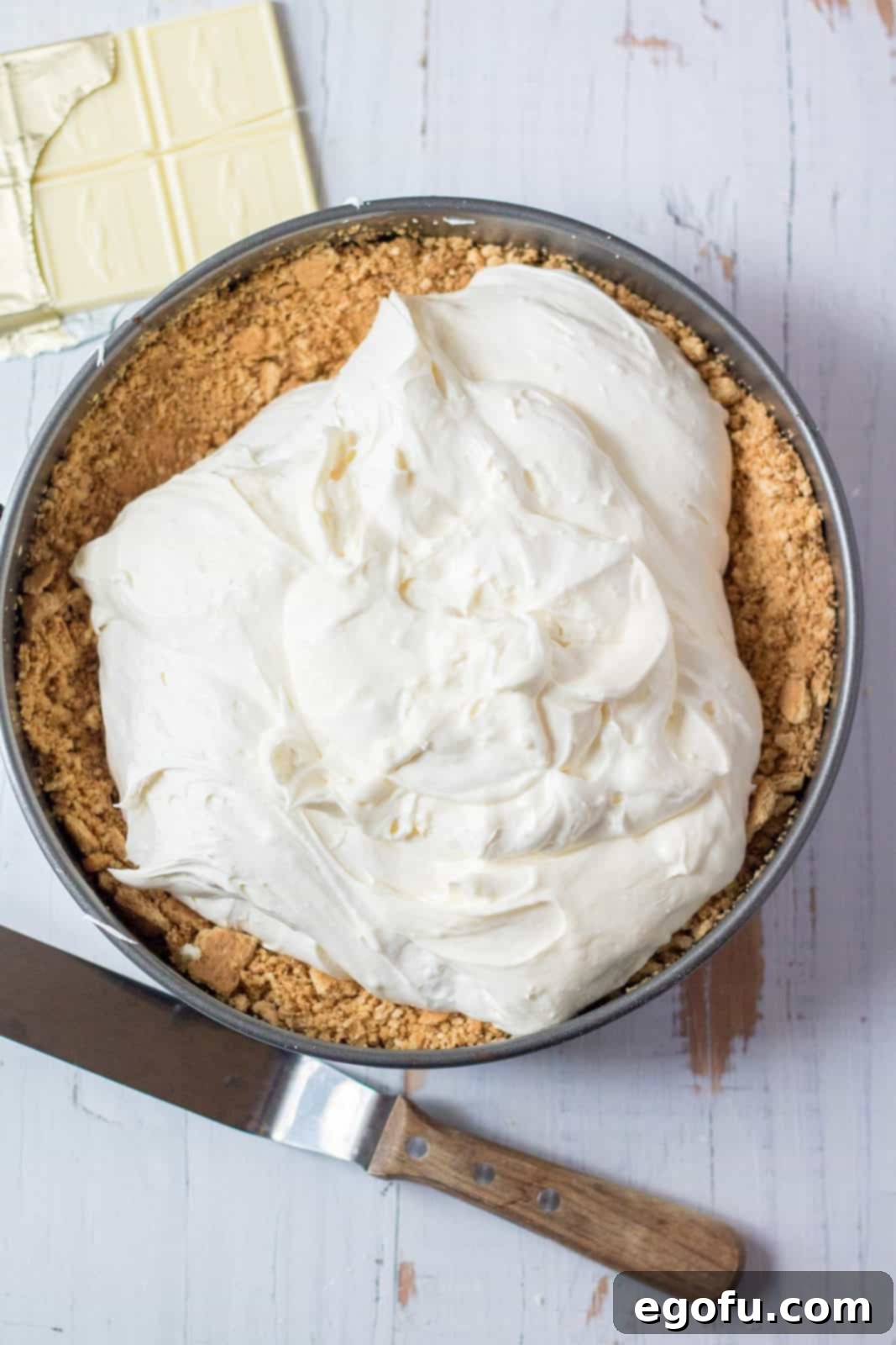 Cheesecake batter poured into crust.