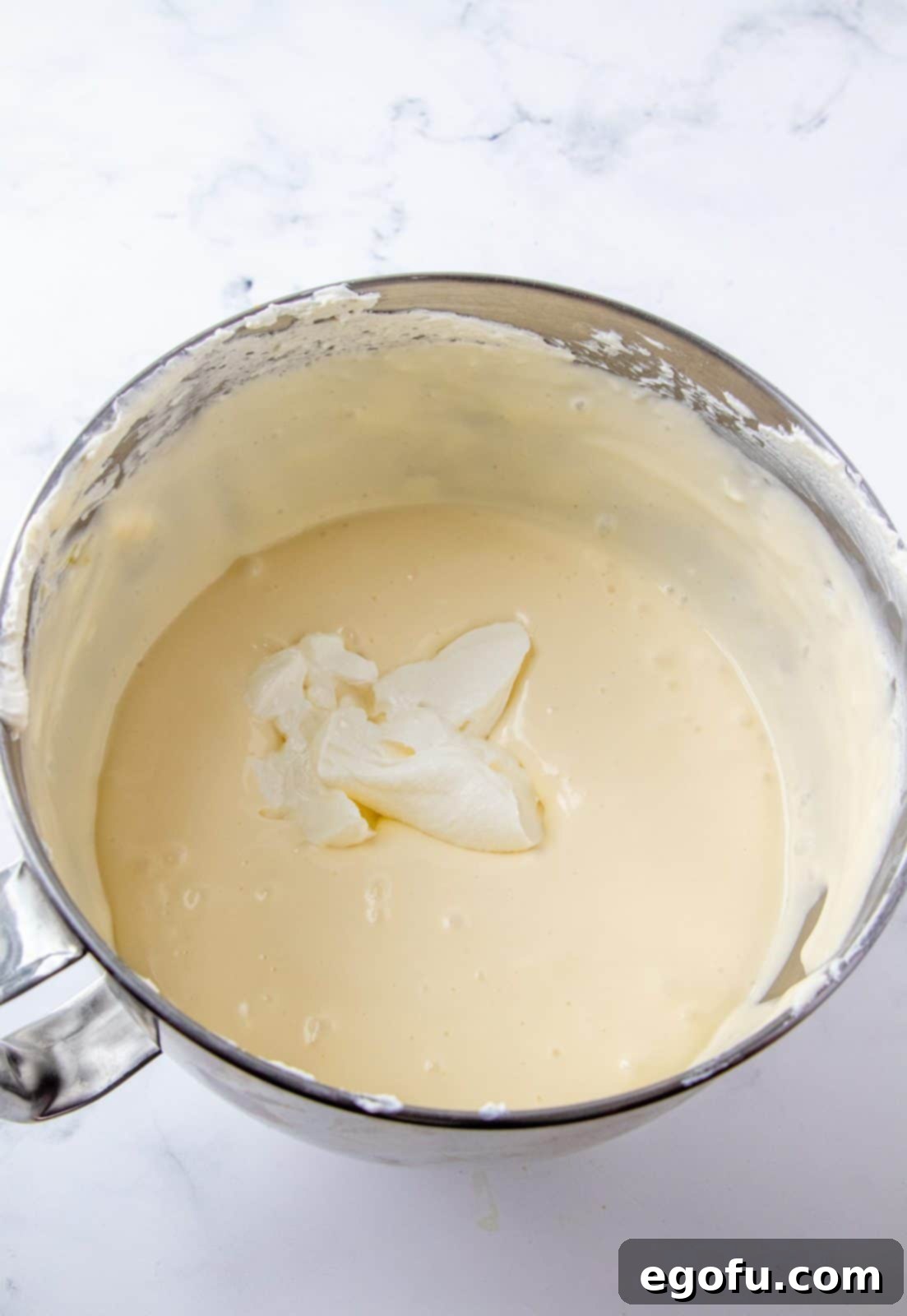 Sour cream added to cream cheese mixture.