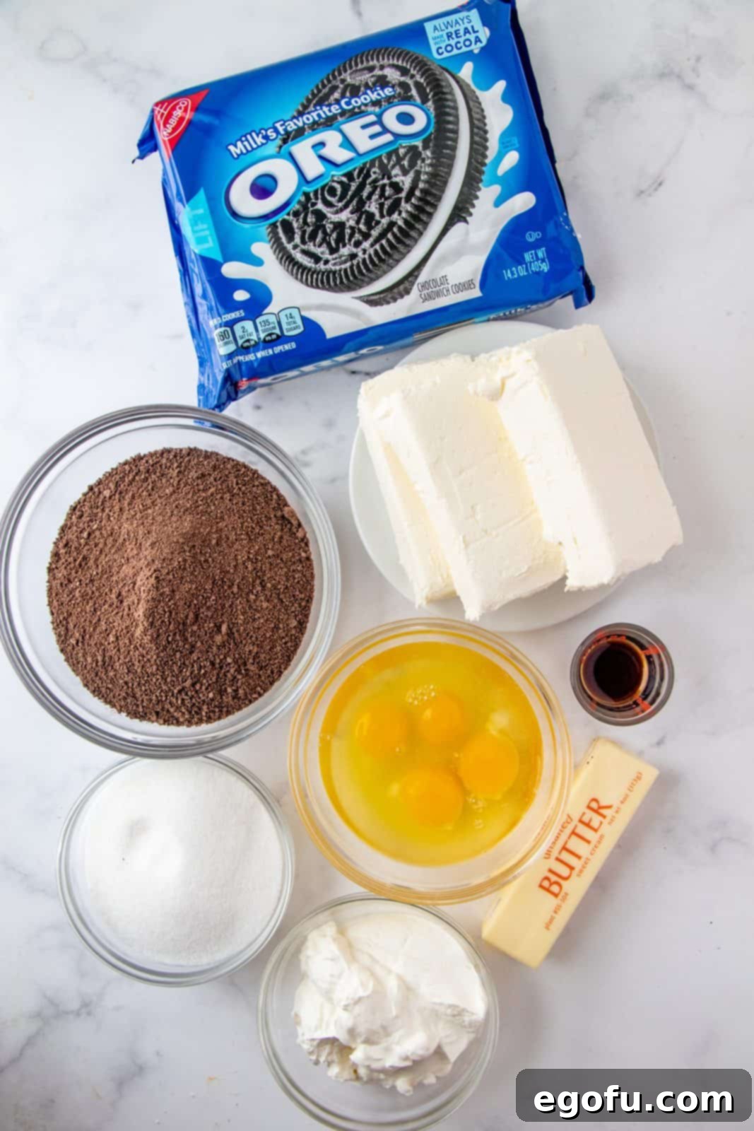 Ingredients needed: chocolate graham cracker crumbs, granulated sugar, unsalted butter, cream cheese, vanilla extract, eggs.