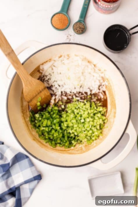 Onion, bell pepper and celery added to dutch oven