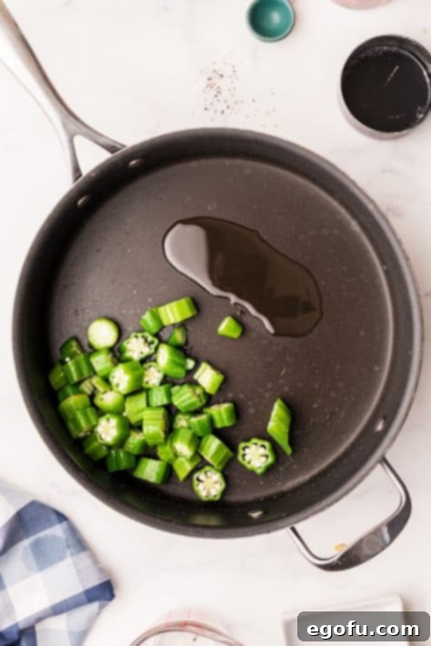 Okra added to pan with oil