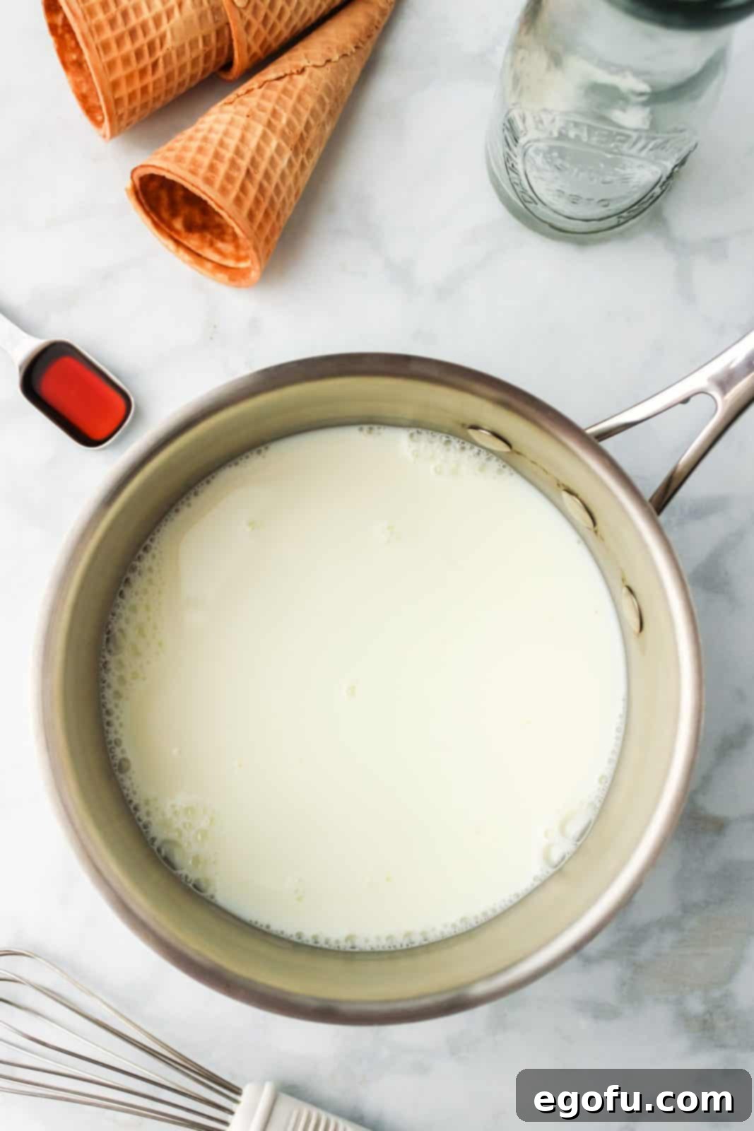 Milk and sugar in saucepan