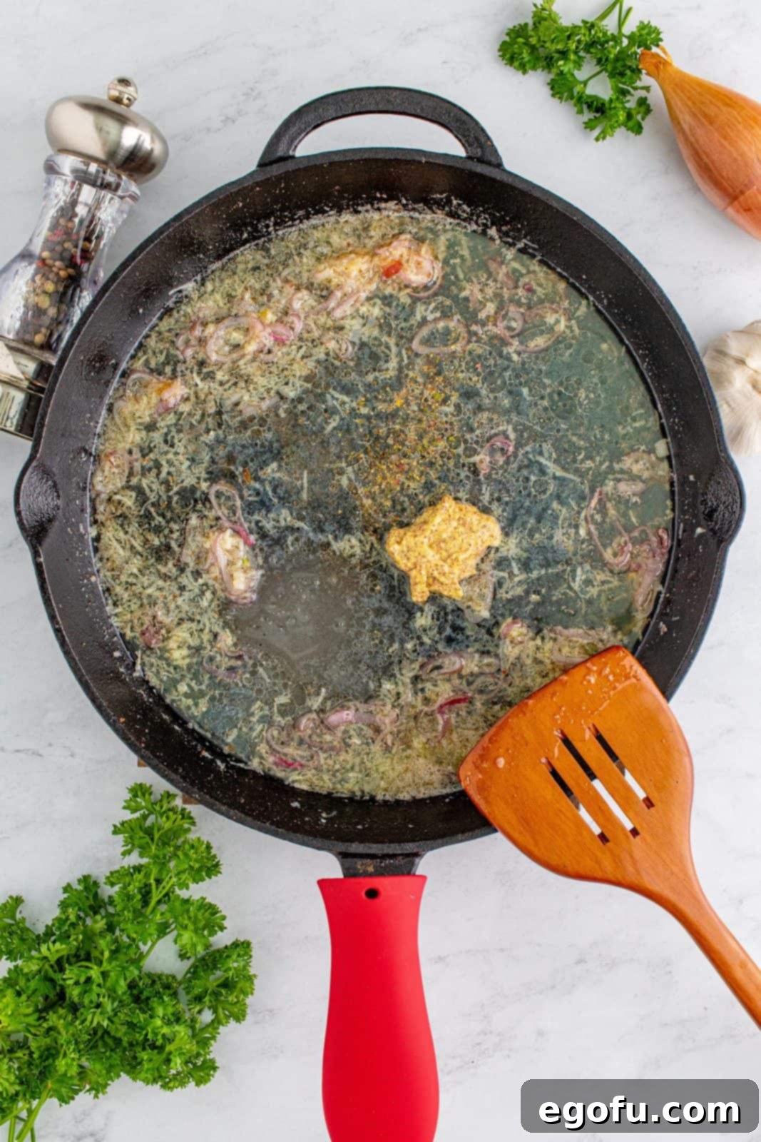 Hearty German Potato Salad 10 All dressing ingredients: apple cider vinegar, chicken stock, granulated sugar, whole grain mustard, and black pepper, just added to the skillet.