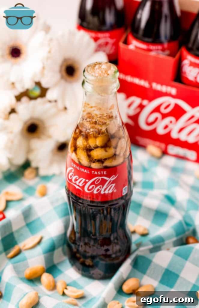 The Classic Cola Crunch 5 A chilled bottle of Coca-Cola fizzing as peanuts are dropped in, ready for enjoyment
