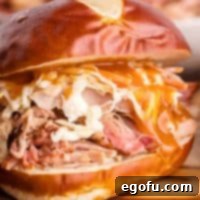 Square close up image of Smoked Pulled Pork as a sandwich