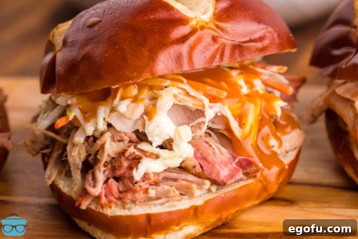 Smoked Pulled Pork on pretzel bun with BBQ Sauce
