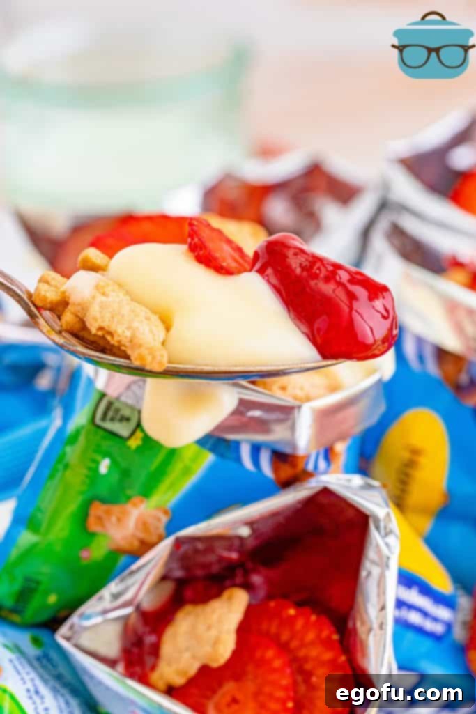 The Wandering Strawberry Cheesecake 11 Spoon with cheesecake from bag on it